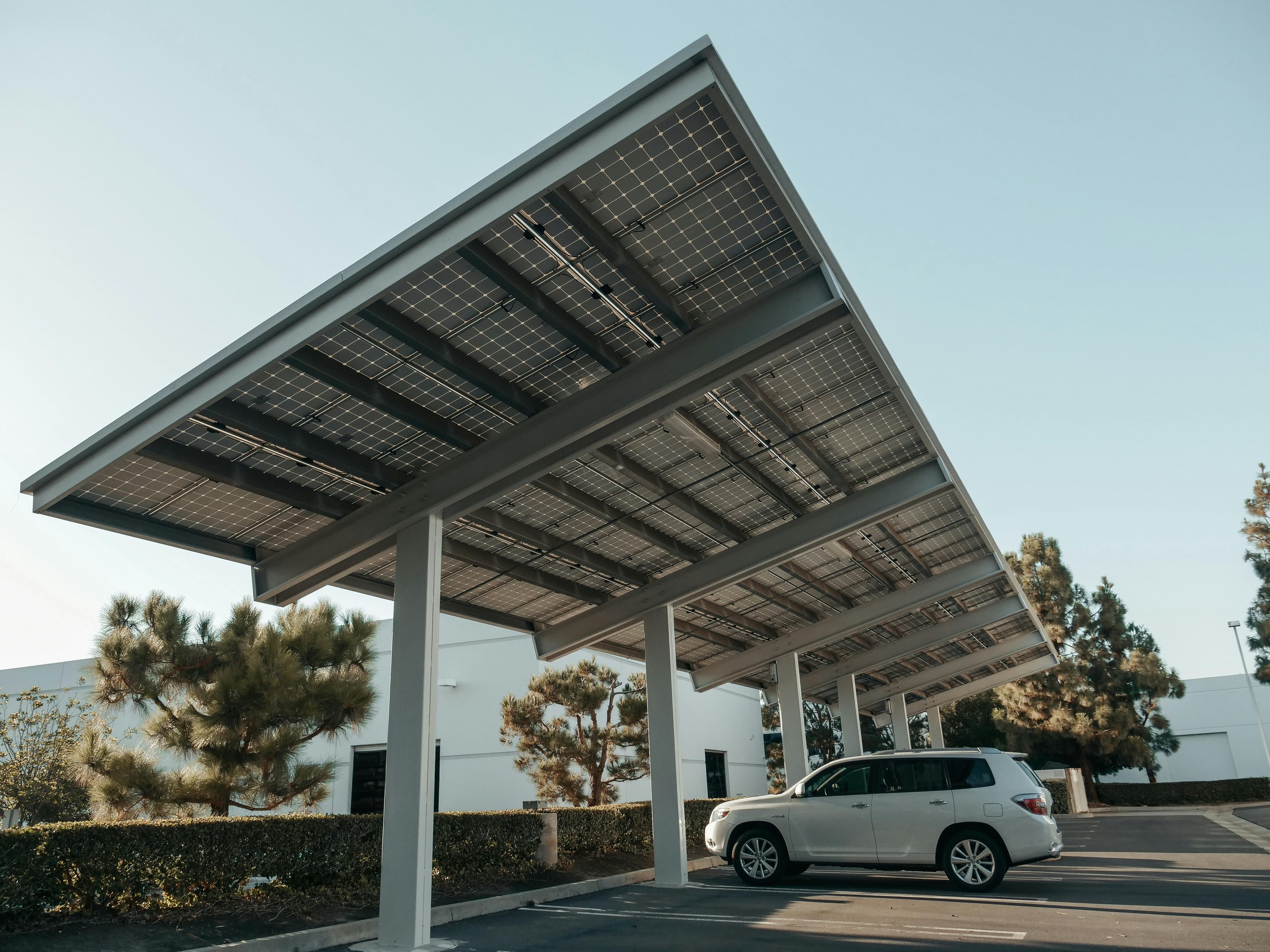 Solar carport installation with white car
