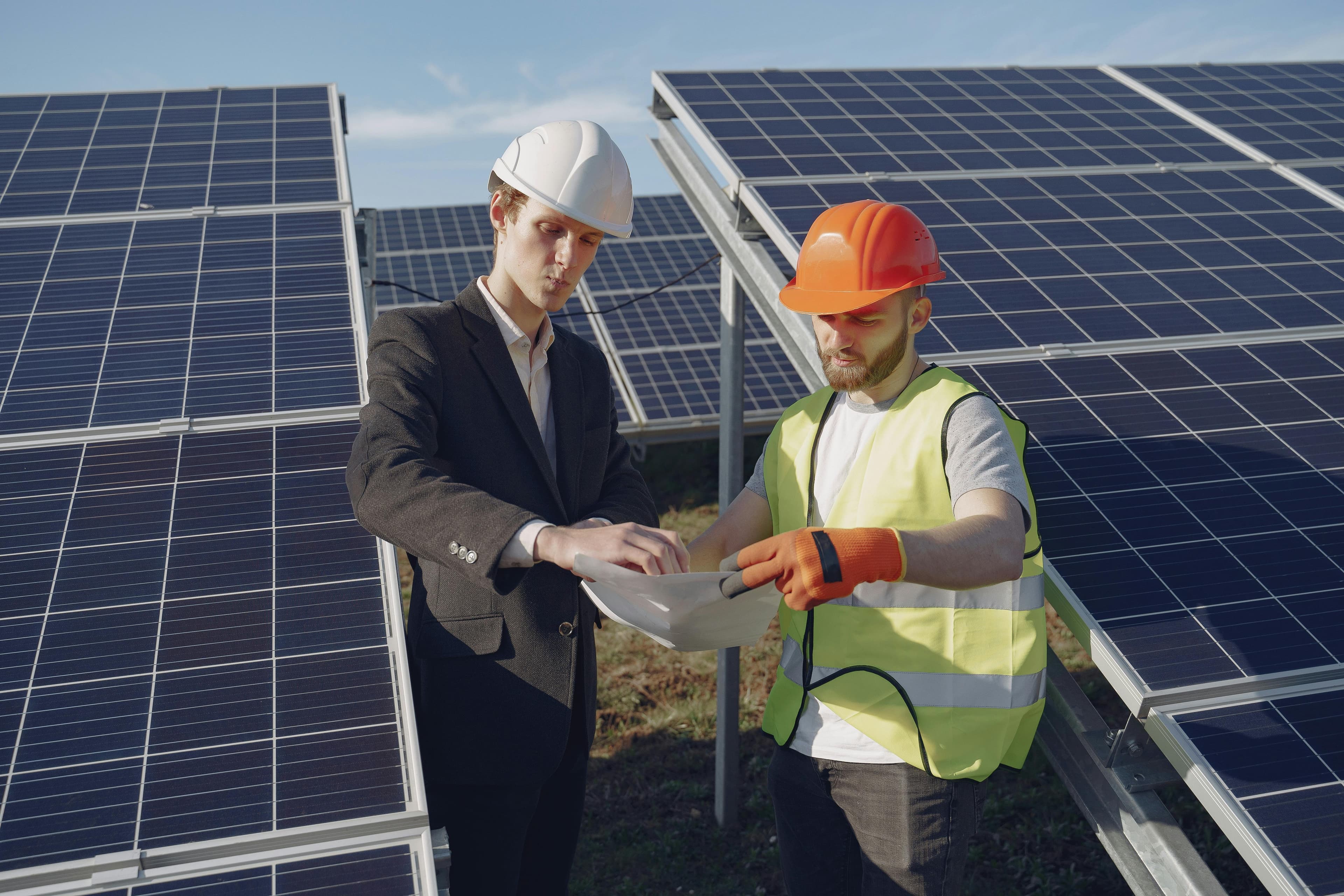 KLY Energy team reviewing a commercial solar project
